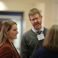 Trista Bergerud (left), Dr. Booth (center) and Sheri DeVries speaking